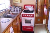 Fantastic Retro Kitchen and Red & White Vintage Gas Stove in 1950 Spartanette Tandem